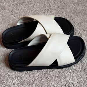 UGG Black and Cream Cross Strap Sandals brand new. Leather
